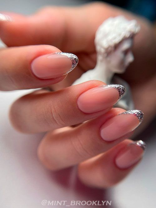 Sophisticated Soft Pink Nail Design with Delicate Silver French Tips.