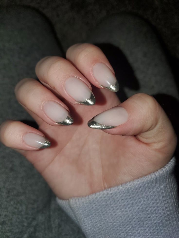 Chic Almond-Shaped Nails: Soft Nude Base with Glamorous Metallic Silver Tips