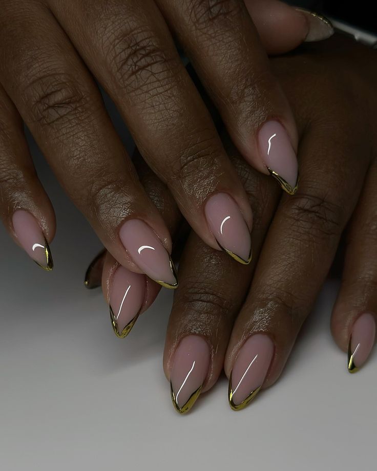 Chic Nude Base with Golden Tips: A Sophisticated Nail Design for Any Occasion.