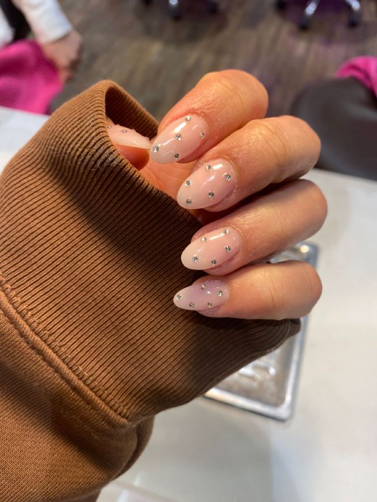 Elegant Nude French Tip Nails with Subtle Rhinestone Accents