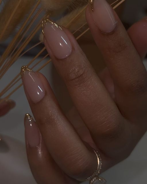 Sophisticated Soft Nude Nail Design with Delicate Gold Tips for All Occasions.