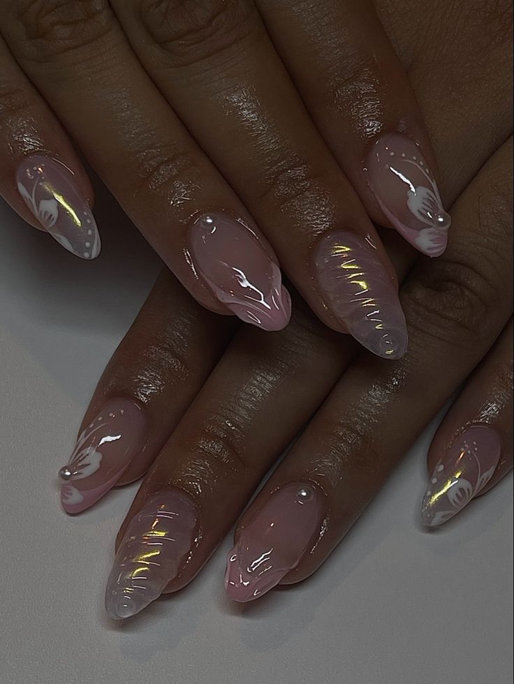 Sophisticated Almond-Shaped Nails with Soft Pink Base, Artistic Swirls, and Pearl Accents.