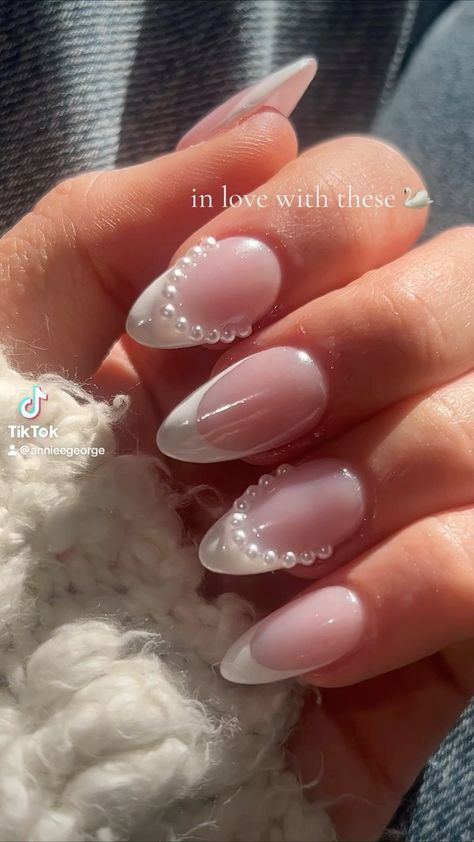 Chic Almond-Shaped French Tip Nails in Soft Pink and White with Pearls.