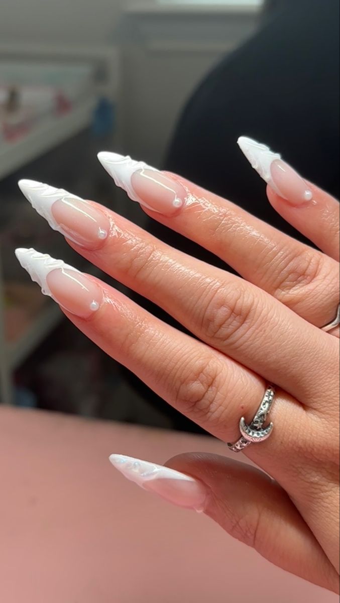 Sophisticated Almond-Shaped Nail Design with Glossy Finish and Elegant White Accents.