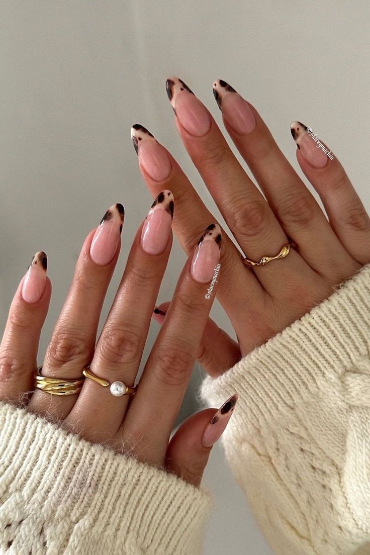 Chic Almond-Shaped Nails: Soft Pink with Trendy Leopard Tips and Minimalist Gold Accents