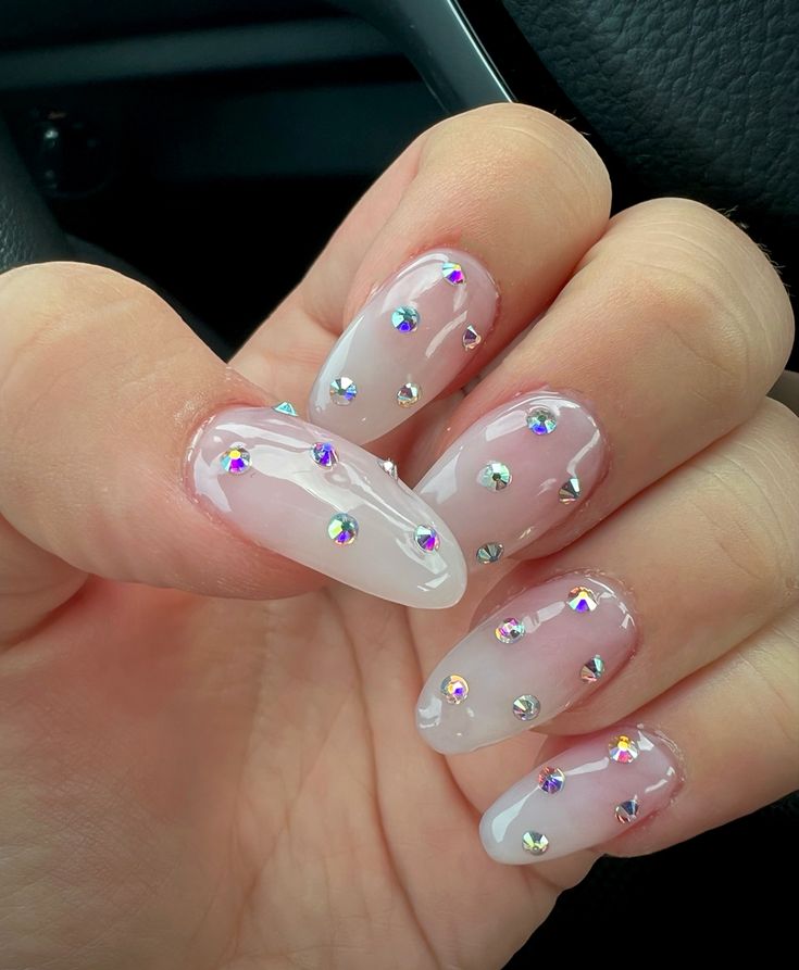 Elegant Translucent Nail Design with Sparkling Rhinestones for Any Occasion