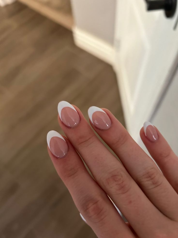 Sophisticated Two-Tone French Manicure with Nude and White Shades.