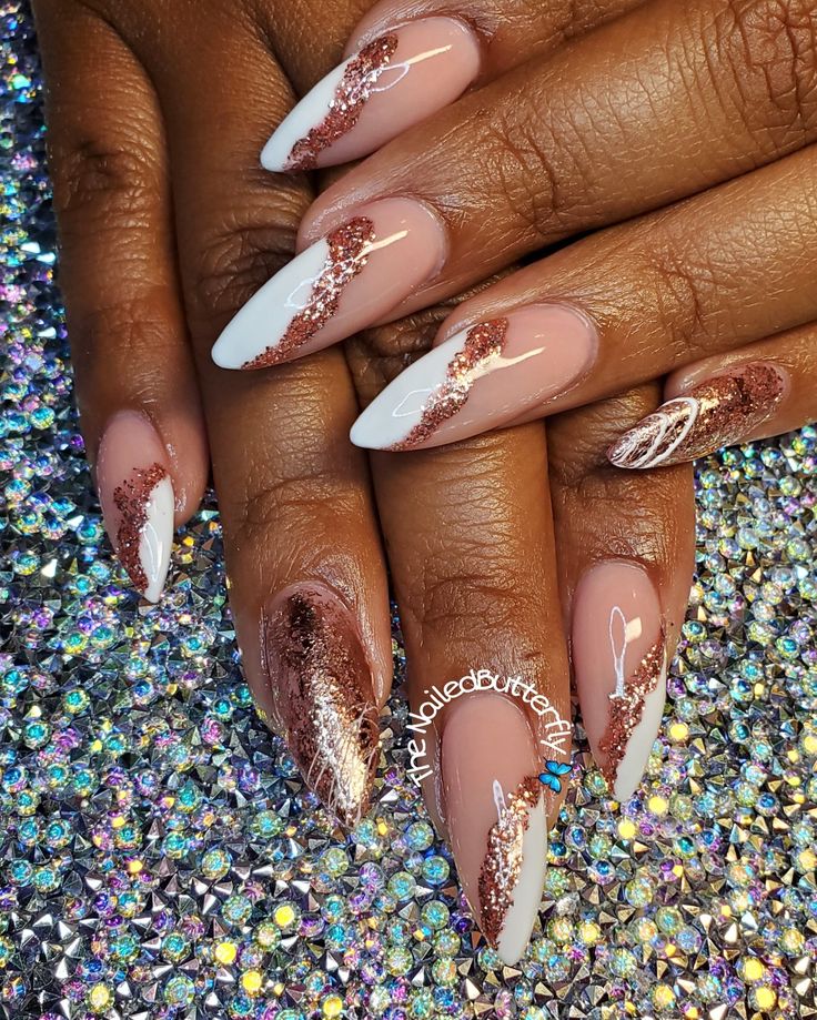 Chic Almond-Shaped Nails with Glamorous Rose Gold Glitter Waves and Elegant White Accents.