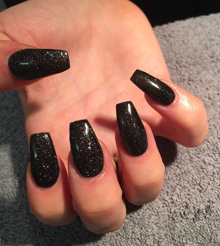 Elegant Black Glitter Coffin Nails: Sophisticated Sparkle for Special Occasions.