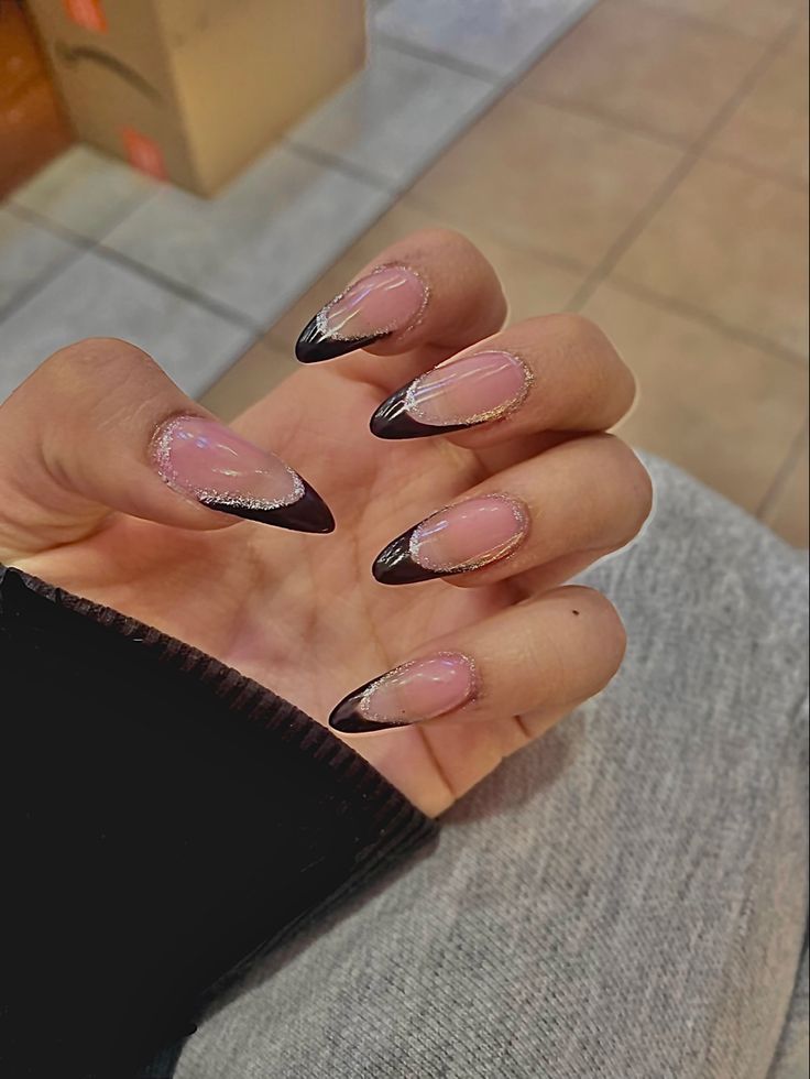 Sophisticated Elegant Nail Design with Nude and Deep Brown Tips and Delicate Silver Accents.