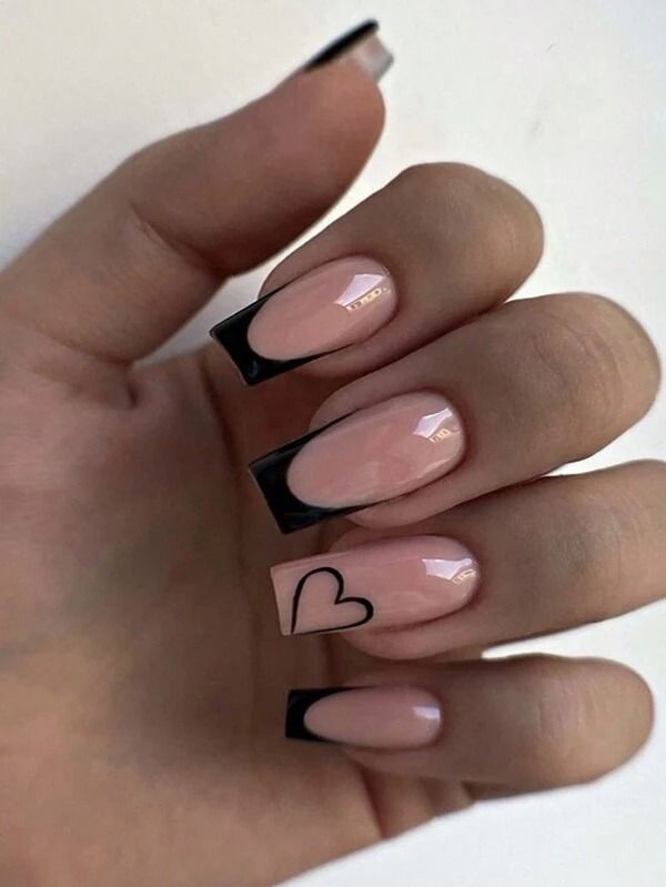 Chic Nail Design: Soft Nude Base with Playful Black French Tips and Heart Outline.