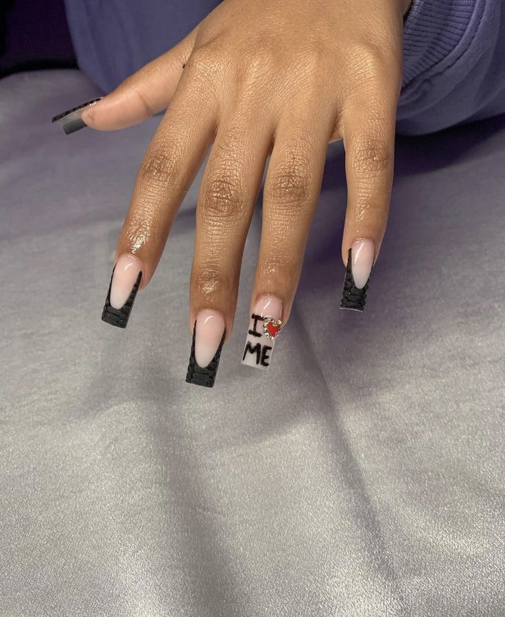 Chic Long Nails: Nude and Black Glossy Design with Unique Textures and Art.