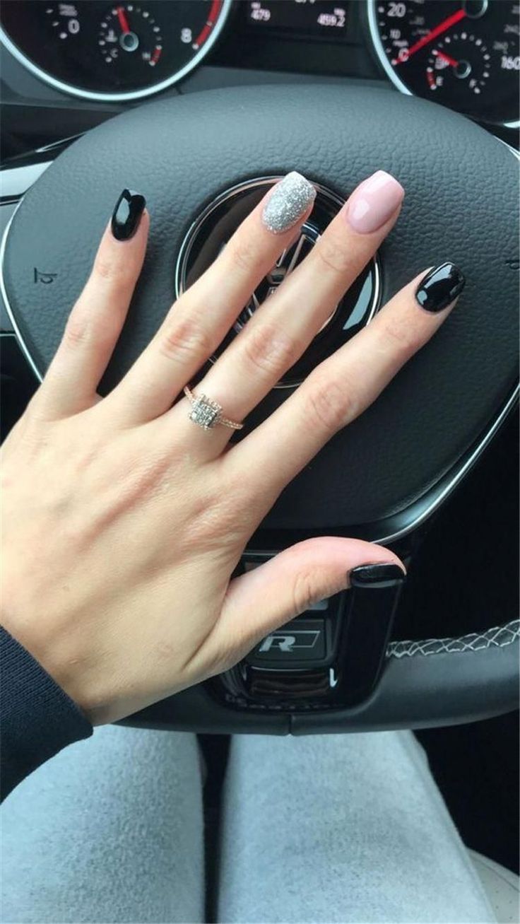 Chic Multicolored Nail Design Blending Glossy Black, Shimmering Silver, and Soft Pink for a Modern Aesthetic.