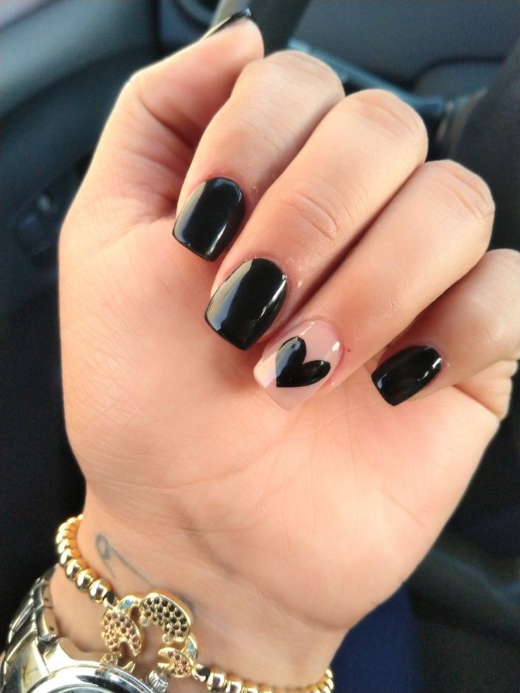 Elegant Black Nail Design: Matte and Glossy Finishes with Heart-Shaped Accent for Versatile Charm.