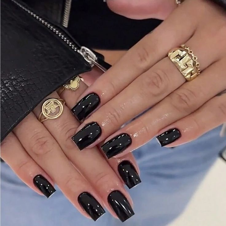 Chic Glossy Black Nail Design: A Modern Sophistication Statement.