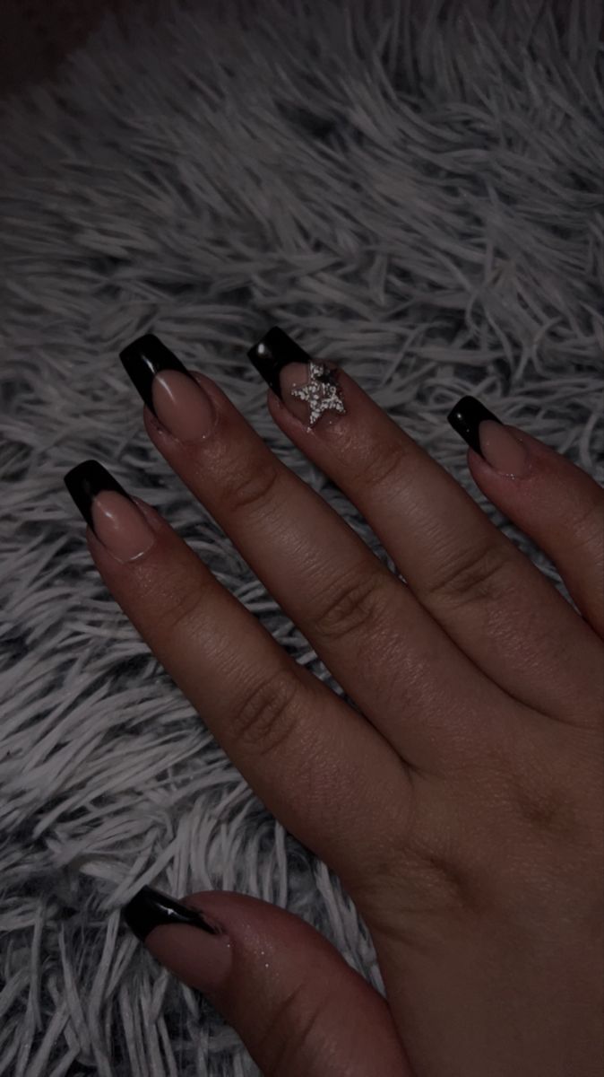 Bold Elegance: Classic French Manicure with Black Tips and Glamorous Accent Charm.