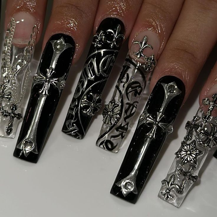 Bold Black and Clear Intricate Nail Design with Metallic Accents and Edgy Floral Motifs.