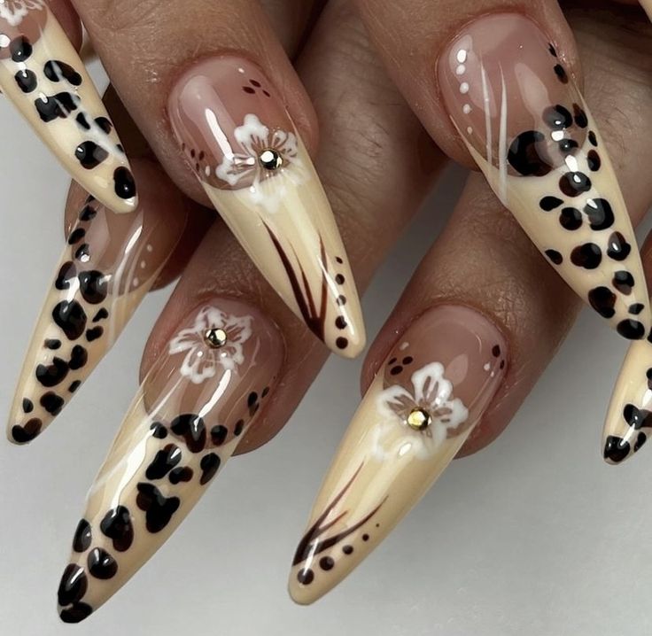 Chic Almond-Shaped Nails: Nude and Cream with Black Leopard Spots and Floral Accents