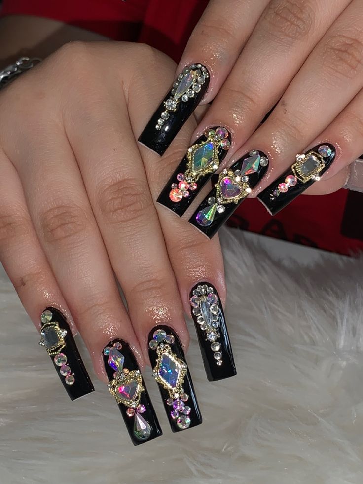 Glamorous Long Black Acrylic Nails Enhanced with Colorful Gemstones and Intricate Designs