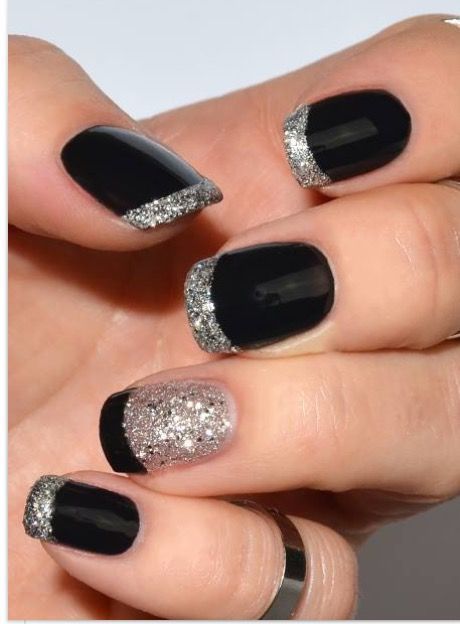 Chic Black and Silver French Manicure with Glittery Accents.