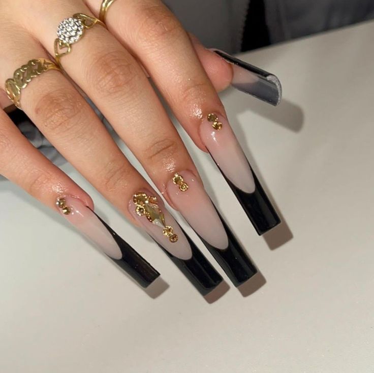 Elegant Gradient Long Nails with Bold Black Tips and Gold Embellishments