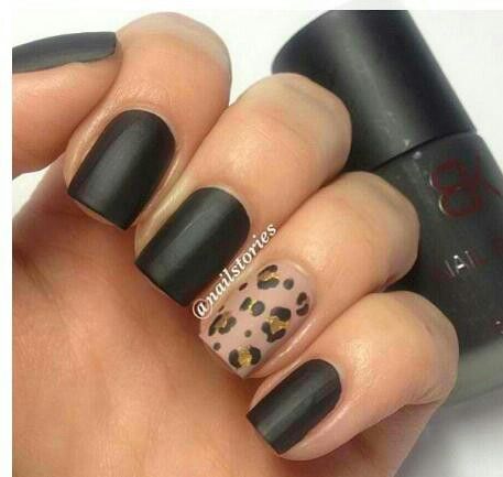 Chic Matte Black Nails with Bold Leopard Accent for a Sophisticated Look.