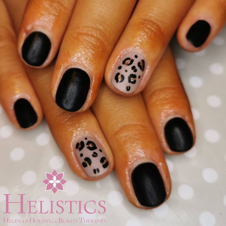 Chic Nail Art: Matte Black and Beige with Leopard Print Accent for Bold Elegance.