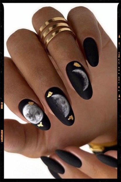 Sophisticated Moon-Inspired Nail Design with Matte Black Finish and Golden Accents