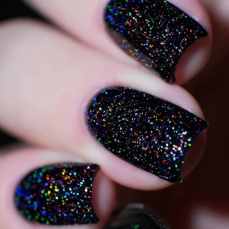 Enchanting Holographic Glitter Black Nail Design: A Bold and Striking Statement.