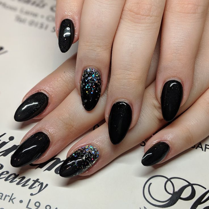 Elegant Black Manicure: Glossy and Glitter Finishes with Striking Holographic Accent Nail