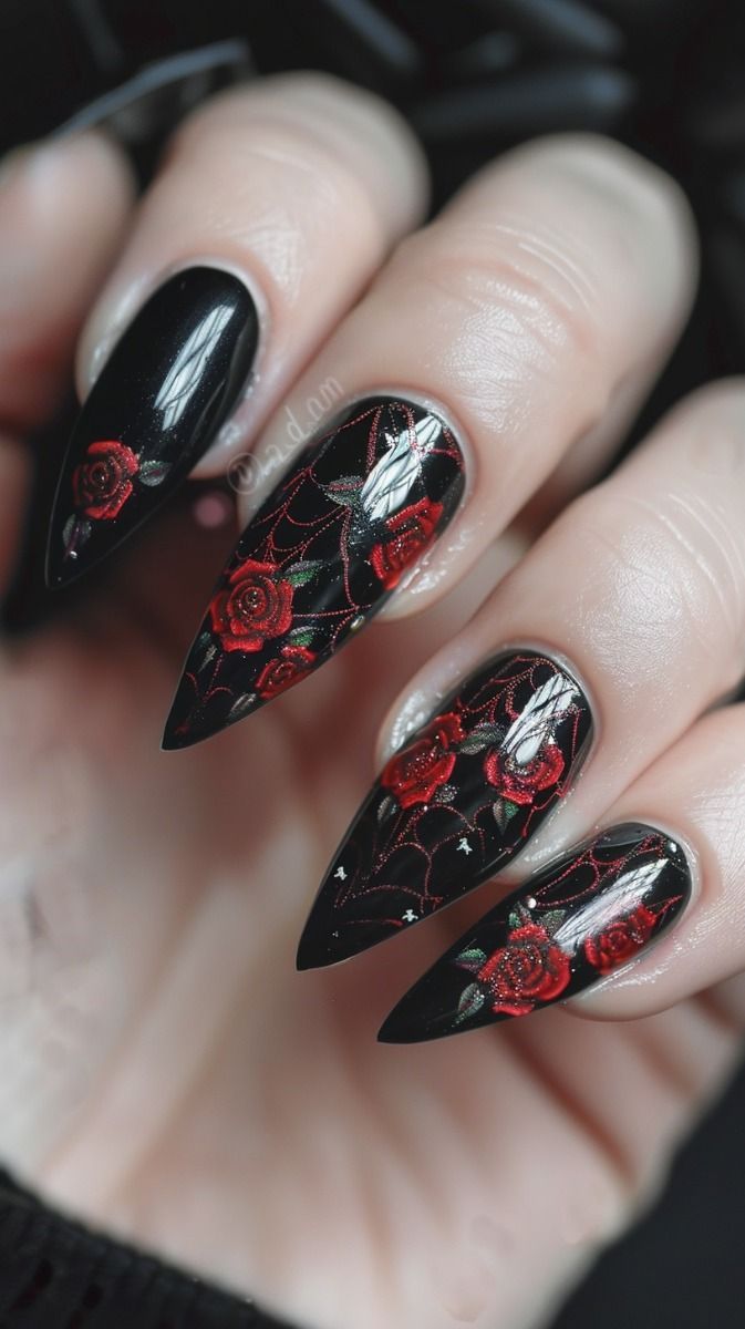 Gothic Elegance: Bold Black Nail Design with Intricate Red Roses and Spiderweb Patterns.