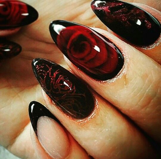 Striking Elegant Nail Art: Deep Red Roses on Glossy Black with Almond Shape and Muted Blush Accents.