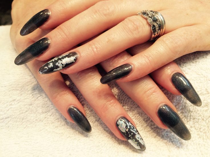 Elegant Almond-Shaped Nail Design: Black-to-Metallic Ombre with Silver Accents