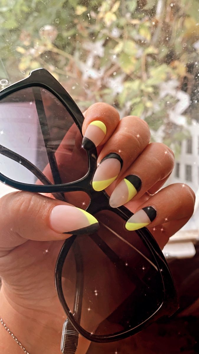 Playful Neon Nail Design with Bold French Tips and Stylish Sunglasses for a Fun Summer Look.