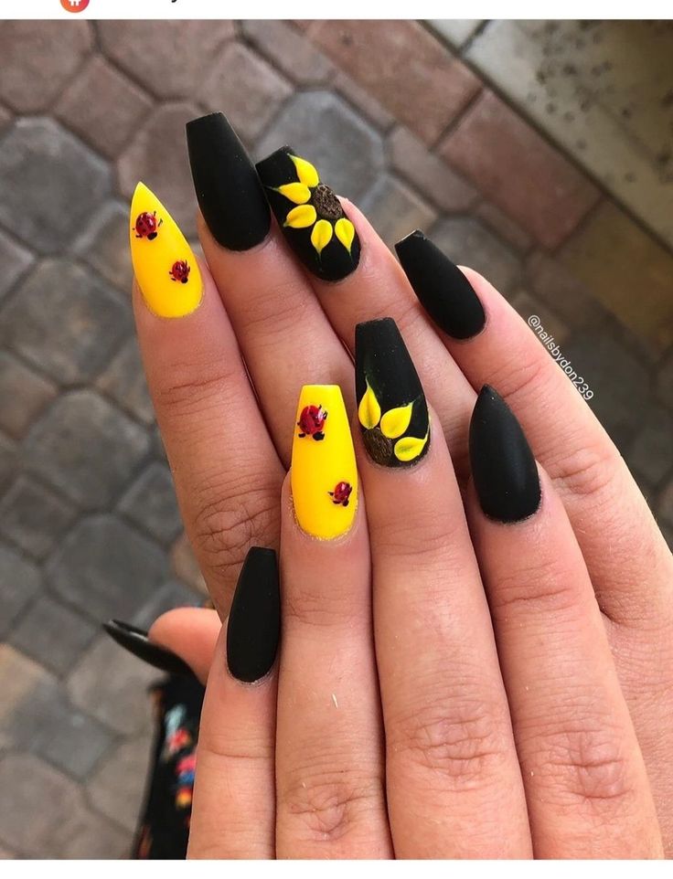 Bold Yellow and Black Nail Design with Hand-Painted Sunflowers and Red Floral Accents.