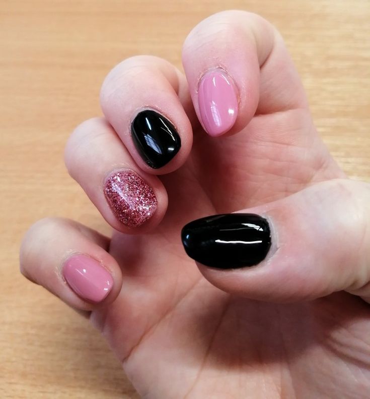 Chic and Trendy Multi-Textured Nail Design with Soft Pink, Bold Black, and Glitter.