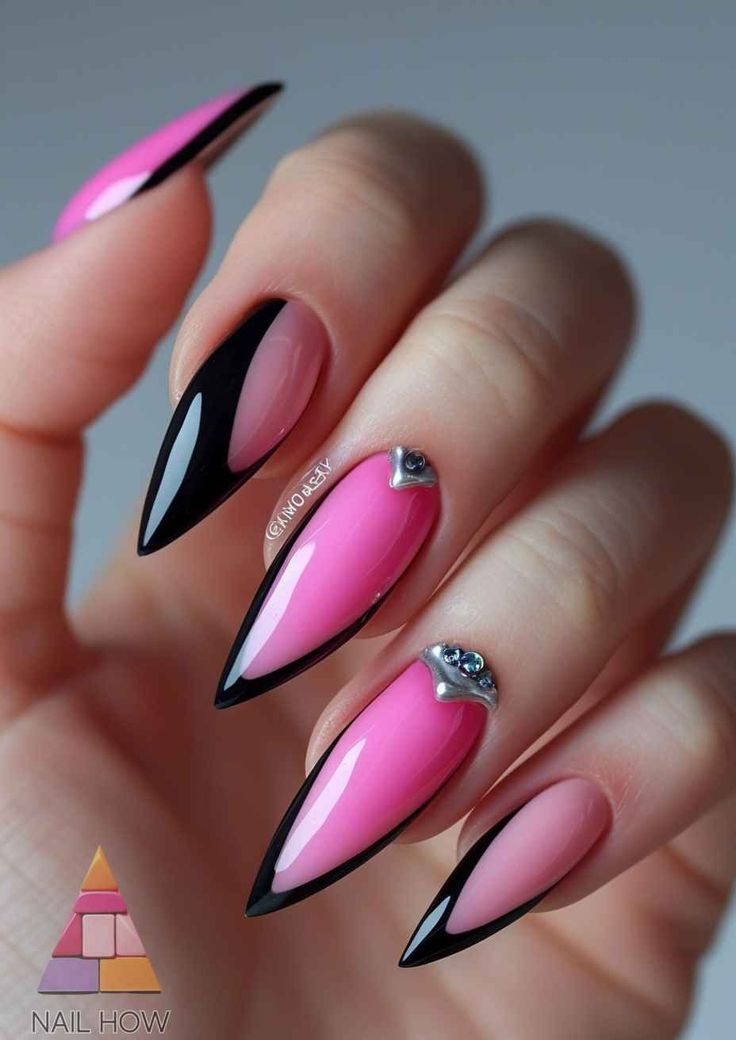 Chic Almond-Shaped Nail Design with Glossy Pink, Bold Black, and Rhinestone Accents.