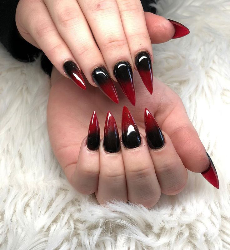 Edgy Almond-Shaped Nail Design with Vibrant Red and Glossy Black Gradient.