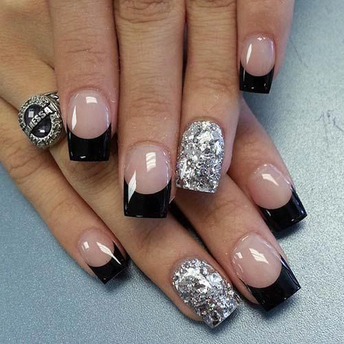 Chic Black and Silver Manicure with Glamorous French Tips and Glitter Accent.