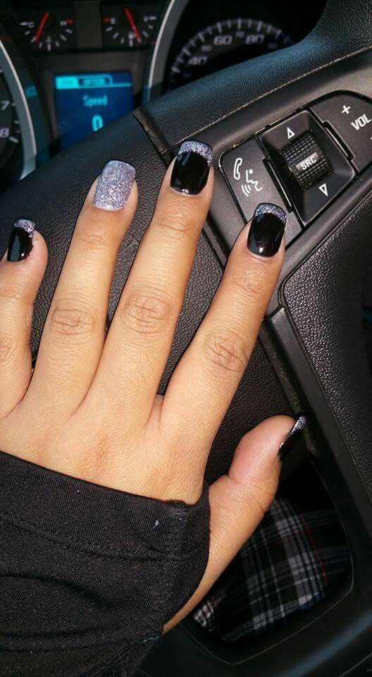 Chic Black and Silver Nail Design: Striking Elegance with Matte and Glitter Finishes.