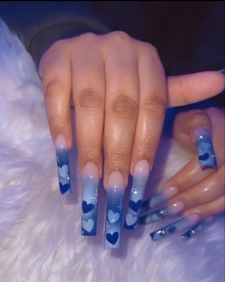 Elegant Blue Ombre Nails with Heart Patterns and Sparkling Details