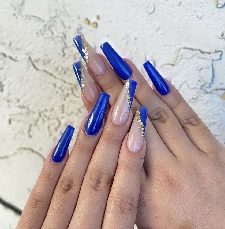 Elegant Blue and Nude Ombre Nails with Glamorous Gold Accents.