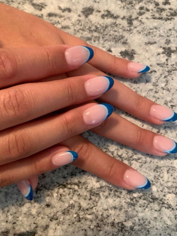 Chic French Tip Manicure: Modern Blue Contrast on Natural Pink Base.