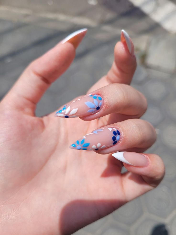 Elegant Floral Nail Design with Transparent Base and Pointed Tips