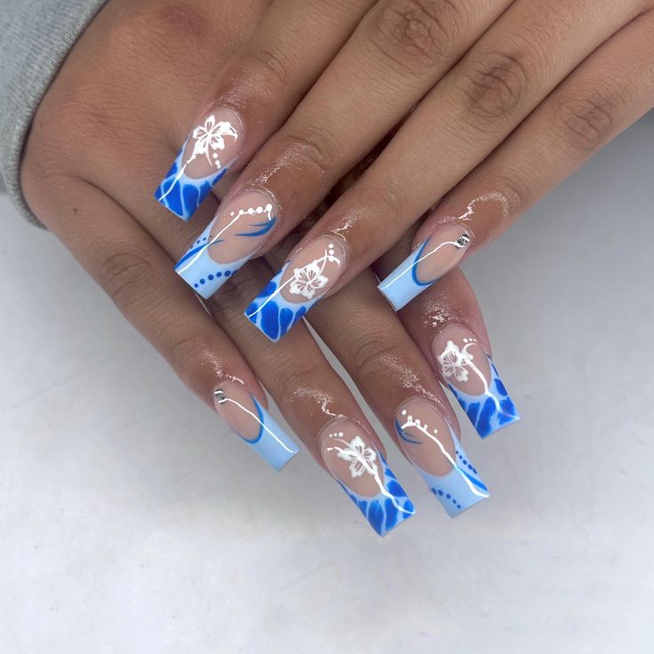 Chic Floral Nail Design in Vibrant Blue and White with Elegant Oceanic Patterns