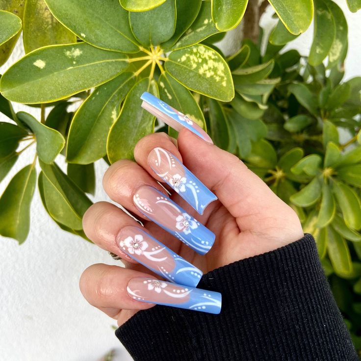 Elegant Floral-Inspired Nail Design with Soft Blue and Translucent Finishes