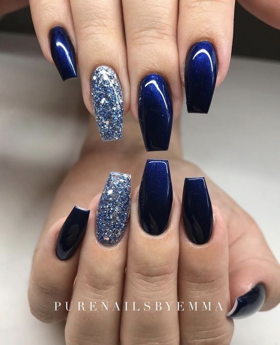 Elegant Navy Nail Design with Dazzling Glitter Accents for Special Occasions.