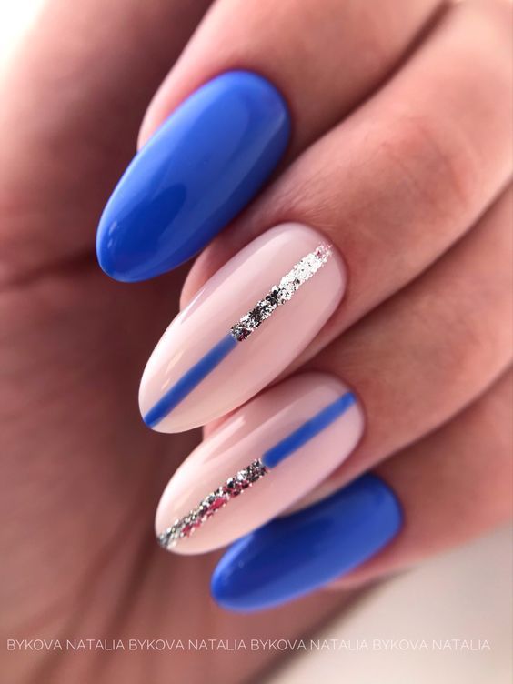 Chic Nail Design: Vibrant Blue with Nude Tones and Silver Accents