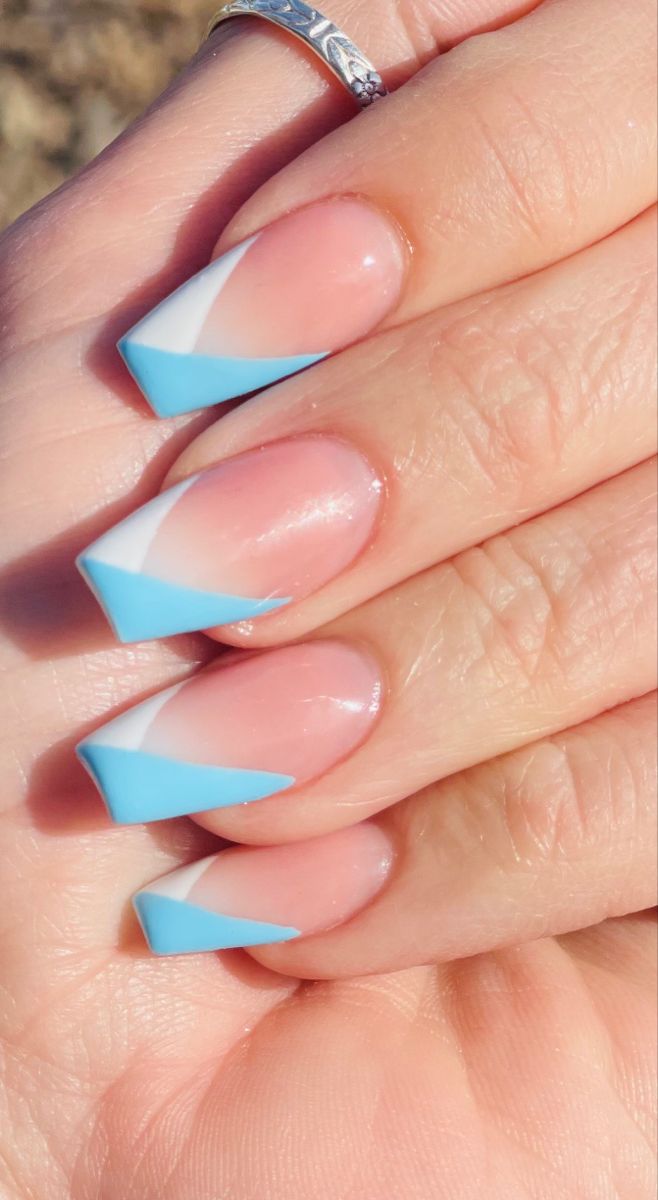 Captivating Dual-Tone Nails: Modern Geometric Design in Soft Pink and Vibrant Blue.