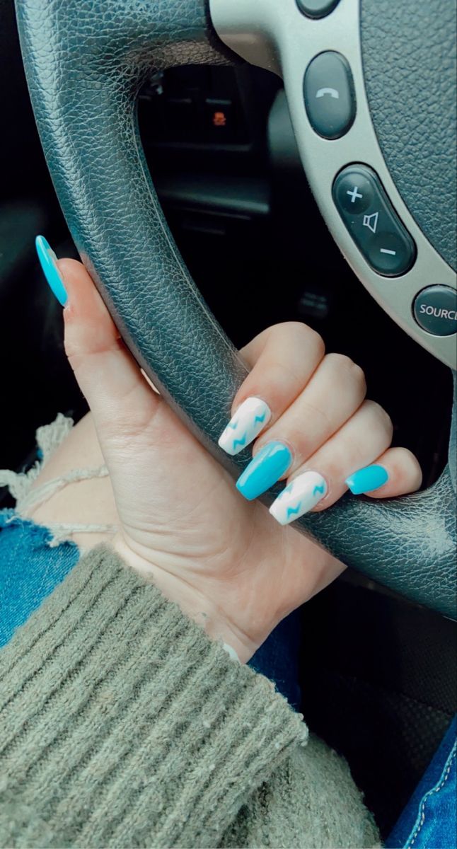 Playful Sky Blue and White Lightning Bolt Nail Design for a Fun, Bold Statement.